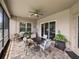 Comfortable screened lanai with ample seating and a view of the outdoors at 34652 Heavenly Ln, Dade City, FL 33525