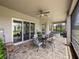 Spacious screened lanai offering seating, a hot tub, and lovely backyard views at 34652 Heavenly Ln, Dade City, FL 33525