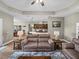 Spacious living room showcases hardwood floors, plush sofas, and an open layout to the dining area at 34652 Heavenly Ln, Dade City, FL 33525