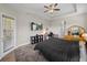 This main bedroom boasts tray ceiling, a ceiling fan, and an adjacent workstation at 34652 Heavenly Ln, Dade City, FL 33525