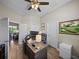 A well-lit office with a fan and a view at 34652 Heavenly Ln, Dade City, FL 33525