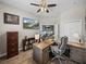 A well-appointed office with a large desk, shelving, and natural light at 34652 Heavenly Ln, Dade City, FL 33525