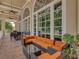 Comfortable patio lounge area with outdoor seating and picturesque views of the surrounding landscape at 34652 Heavenly Ln, Dade City, FL 33525