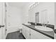 Clean and bright bathroom featuring double sinks, tile flooring, a toilet, and a shower and bathtub at 3512 Tealwood Cir, Palm Harbor, FL 34685