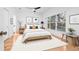 Bright bedroom boasting white walls and neutral furniture with a large window offering plenty of natural light at 3512 Tealwood Cir, Palm Harbor, FL 34685