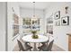 Light and airy breakfast nook features a large window and bright white walls at 3512 Tealwood Cir, Palm Harbor, FL 34685