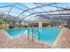 Community pool area featuring a covered pavilion, perfect for recreation and relaxation at 3512 Tealwood Cir, Palm Harbor, FL 34685