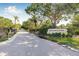 Brookhaven community entrance with lush landscaping and a welcoming sign at 3512 Tealwood Cir, Palm Harbor, FL 34685