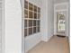 Bright foyer with a window and glass front door allowing natural light at 3512 Tealwood Cir, Palm Harbor, FL 34685