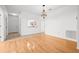Open concept living room with hardwood floors and lots of natural light at 3512 Tealwood Cir, Palm Harbor, FL 34685
