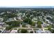 An aerial view shows the home nestled among lush trees in a residential neighborhood at 3547 55Th N St, St Petersburg, FL 33710