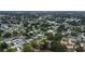 Aerial view of a single-Gathering home in a mature residential neighborhood with green lawns at 3547 55Th N St, St Petersburg, FL 33710