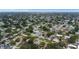 A high aerial of a residential neighborhood showing houses, streets, and trees at 3547 55Th N St, St Petersburg, FL 33710