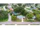 Aerial view featuring the backyard patio with a fire pit, showing neighborhood layout at 3547 55Th N St, St Petersburg, FL 33710