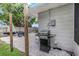 A backyard with a grill for outdoor cooking, alongside parking for a boat trailer at 3547 55Th N St, St Petersburg, FL 33710