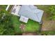 Aerial view of a well-maintained backyard with a fire pit and outdoor seating area at 3547 55Th N St, St Petersburg, FL 33710