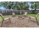 Cozy backyard fire pit area with chairs provides a relaxing outdoor entertainment space at 3547 55Th N St, St Petersburg, FL 33710