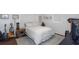 Bright bedroom with warm wood floors, a decorative rug, and cozy furnishings at 3547 55Th N St, St Petersburg, FL 33710