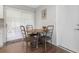 Cozy dining area with a round table, seating for four, and natural light from sliding glass doors at 3547 55Th N St, St Petersburg, FL 33710