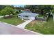 Single-story home boasting a well-manicured front yard and a long driveway leading to the garage at 3547 55Th N St, St Petersburg, FL 33710