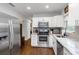 Well-equipped kitchen featuring stainless steel appliances, white cabinets, and marble countertops at 3547 55Th N St, St Petersburg, FL 33710