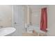 Well-lit bathroom with a white vanity, toilet, and bathtub with shower at 3862 Tristram Loop, Land O Lakes, FL 34638