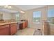 Bathroom with granite countertops, tiled floors, and glass-enclosed shower at 3862 Tristram Loop, Land O Lakes, FL 34638