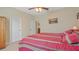 Bedroom featuring a wood frame bed, white walls, and modern fan with lighting at 3862 Tristram Loop, Land O Lakes, FL 34638