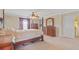 Spacious bedroom featuring a ceiling fan, walk-in closet and a four-post bed at 3862 Tristram Loop, Land O Lakes, FL 34638