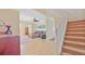 Foyer with staircase, view into the living room, and tiled floor at 3862 Tristram Loop, Land O Lakes, FL 34638