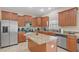 Updated kitchen with granite countertops, stainless steel appliances and center island at 3862 Tristram Loop, Land O Lakes, FL 34638