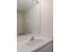 Bathroom features a single sink vanity, an oval mirror, and tile flooring at 4228 Savage Station Cir, New Port Richey, FL 34653