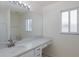Bathroom featuring dual sinks, a large mirror, and ample counter space at 4228 Savage Station Cir, New Port Richey, FL 34653