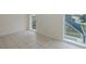 Bedroom with tiled floors, arched windows, and a view of the pool and patio at 4228 Savage Station Cir, New Port Richey, FL 34653