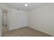 Bright bedroom features neutral walls, carpet flooring, ceiling fan, and a closet with bi-fold doors at 4228 Savage Station Cir, New Port Richey, FL 34653