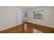 Bright bedroom with wood floors and natural light, featuring dual closets at 4228 Savage Station Cir, New Port Richey, FL 34653