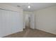 Bedroom with neutral carpet, ceiling fan and a double closet at 4228 Savage Station Cir, New Port Richey, FL 34653