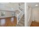 Inviting entryway with staircase and hardwood floors providing a warm welcome at 4228 Savage Station Cir, New Port Richey, FL 34653