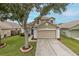 Charming two-story home with a well-maintained lawn and a spacious two-car garage at 4228 Savage Station Cir, New Port Richey, FL 34653