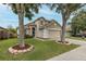 Well-maintained two-story home featuring a two-car garage, landscaped yard, and inviting front entrance at 4228 Savage Station Cir, New Port Richey, FL 34653