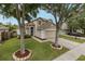 Charming two-story home featuring a two-car garage, landscaped yard, and inviting front entrance at 4228 Savage Station Cir, New Port Richey, FL 34653