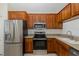 Modern kitchen featuring stainless steel appliances and beautiful wood cabinets at 4228 Savage Station Cir, New Port Richey, FL 34653