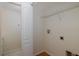 Small laundry room with washer and dryer hookups, a shelf and access to closet at 4228 Savage Station Cir, New Port Richey, FL 34653