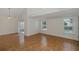 Living room with a slider to lanai, hardwood floors, and lots of natural light at 4228 Savage Station Cir, New Port Richey, FL 34653