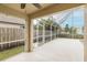 Screened-in patio with ample room and views of the fenced yard at 4228 Savage Station Cir, New Port Richey, FL 34653