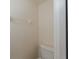 Close-up of a standard white toilet in a small, well-lit bathroom with neutral-colored walls at 4228 Savage Station Cir, New Port Richey, FL 34653