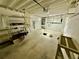 Spacious unfinished basement ready for customization with open ceiling and concrete floor at 440 89Th Ave, St Pete Beach, FL 33706