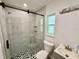 Modern bathroom featuring a glass shower, tile flooring, and new vanity at 440 89Th Ave, St Pete Beach, FL 33706