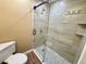 Neutral bathroom featuring a glass-enclosed shower and updated fixtures at 440 89Th Ave, St Pete Beach, FL 33706