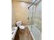 Modern bathroom with updated vanity, wood plank floor, and a glass-enclosed shower at 440 89Th Ave, St Pete Beach, FL 33706